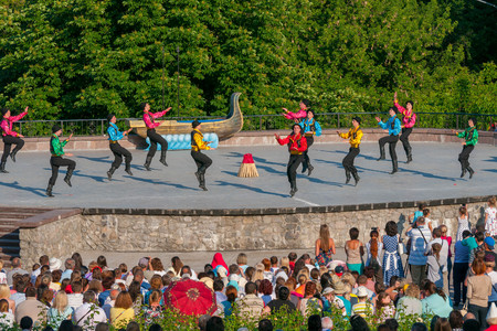 KIEV, UKRAINE - July 22 , 2016: Ukraina School of Dance Ensemble girls and boys dressed in traditional red Ukrainian embroidered costume clothes dancingのeditorial素材