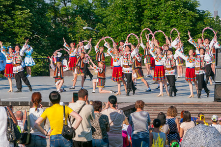 KIEV, UKRAINE - July 22 , 2016: Ukraina School of Dance Ensemble girls and boys dressed in traditional red Ukrainian embroidered costume clothes dancingのeditorial素材