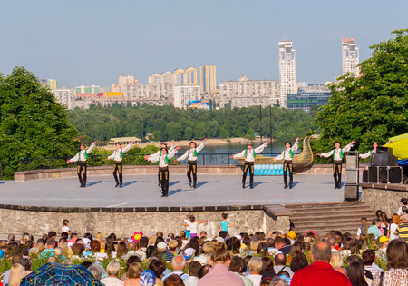 KIEV, UKRAINE - July 22 , 2016: Ukraina School of Dance Ensemble girls and boys dressed in traditional red Ukrainian embroidered costume clothes dancingのeditorial素材