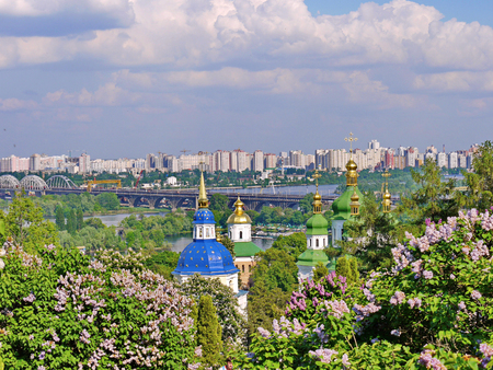 a grandiose urban landscape seen in the distance high-rises in the background of church domesの写真素材
