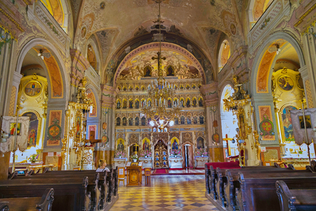 A very beautiful church inside with an altar set with icons, with painted holy walls and frescoes and paintings on the ceiling and pillars.のeditorial素材