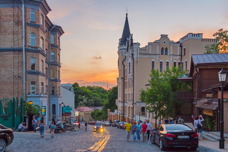 The stone road along which the youth walks and rests on the background of a beautiful, orange sunsetのeditorial素材