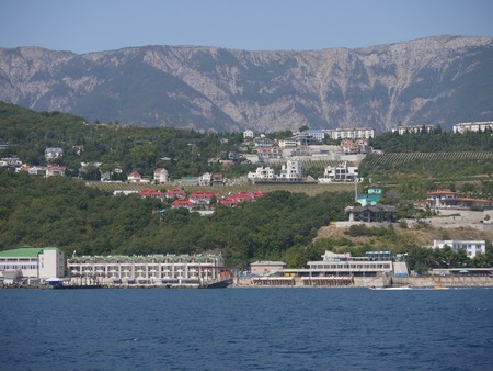 A small city with colorful roofs of houses on the beachの写真素材