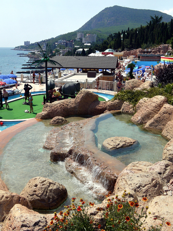 Decorative fountain near the sea promenade with a huge number of touristsのeditorial素材