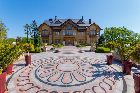 A beautiful square in front of the house with floral patterns and flowers-trees in the horsemen aroundのeditorial素材