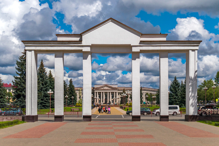 entrance with columns to the city park opposite the beautiful administrative building across the streetのeditorial素材