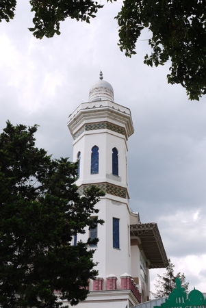 High rectangular eastern building with oblong windows and ornaments against the blue skyのeditorial素材