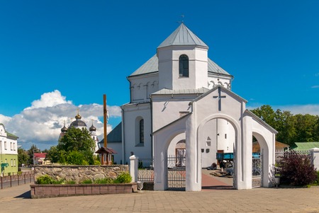 A small white church with a temple and a blue clear sky