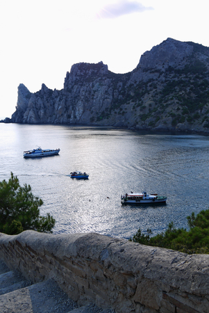 bay in the black sea on the background of steep cliffs covered with grass. Walking on a boatのeditorial素材