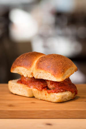 A homemade meatball sandwich on a nice brioche bun.
