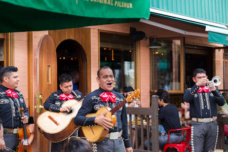 TORONTO, ON, CANADA - JULY 29, 2018: A mariachi band plays in front of a crowd in Torontos vibrant...
