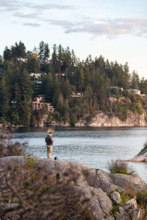 A man flies his drone over the ocean at Whytecliff Park., West Vancouver.