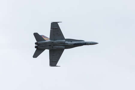 ABBOTSFORD, BC, CANADA - AUG 11, 2019: The RCAF CF-18 performing aerobatic maneuvers at the Abbotsford International Airshow.のeditorial素材