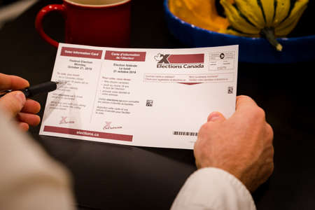 NORTH VANCOUVER, BC, CANADA - OCT 11, 2019: A voter information card for the 2019 Canadian Federal...