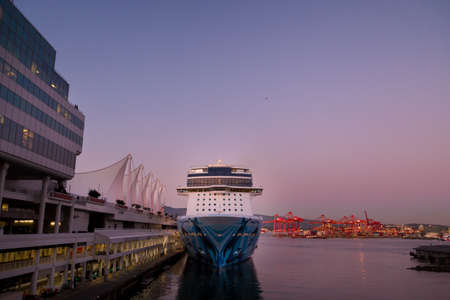 VANCOUVER, BC, CANADA - SEPT 30, 2019: The Norwegian Bliss docked at the Canada Place cruise ship terminal in downtown Vancouver at sunset during cruise ship season.のeditorial素材