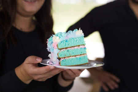 A delicious and sweet colorful birthday cake with multicolored iciingの写真素材