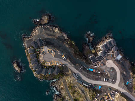 A top down aerial view of a new seaside condo development in Sooke, BC located on a rocky cliff.の写真素材