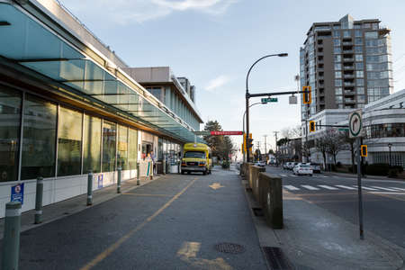NORTH VANCOUVER, BC, CANADA - MAR 19, 2020: Hospital staff wearing medical face masks outside the...