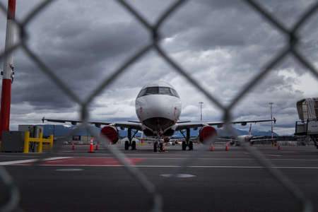 RICHMOND, BC, CANADA - MAR 29, 2020: Air Canada Airbus a320 parked on the tarmac with other aircraft...