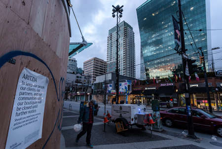 DOWNTOWN VANCOUVER, BC, CANADA - APR 01, 2020: Businesses on Robson street closed down and boarded...