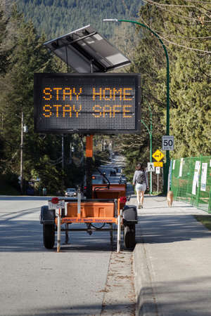 NORTH VANCOUVER, BC, CANADA - APR 11, 2020: A electronic roadside sign displaying information...