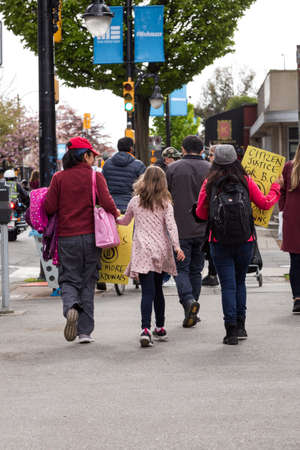 DOWNTOWN VANCOUVER, BC, CANADA - APR 26, 2020: Anti lockdown protesters march in defiance of the government imposed quarantine measures taken to slow the spread of the Covid 19 virus.のeditorial素材