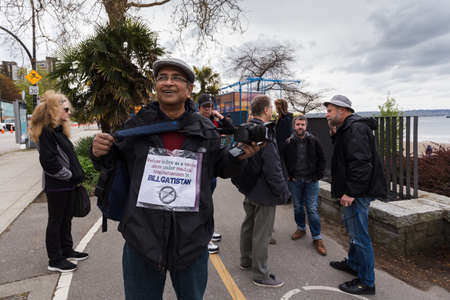 DOWNTOWN VANCOUVER, BC, CANADA - APR 26, 2020: Anti lockdown protesters march in defiance of the...