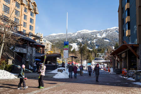 WHISTLER, BC, CANADA - FEB 28, 2021: Whistler Village with people during the Covid 19 pandemic.のeditorial素材