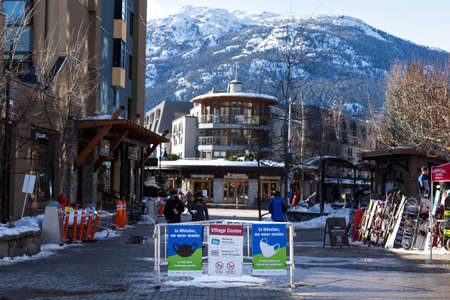 WHISTLER, BC, CANADA - FEB 28, 2021: Covid 19 health advisory signs in Whistler Village.のeditorial素材