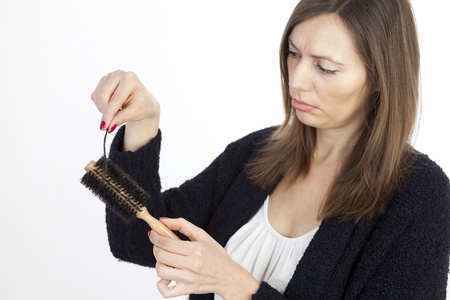 Woman loosing hairの写真素材