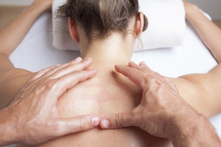 Chiropractor exercising female myofascial therapy  の写真素材