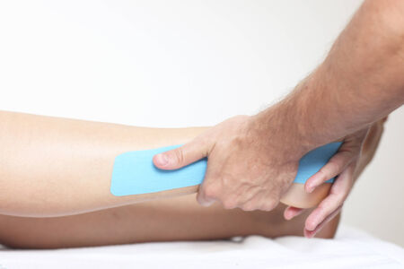 Physio tape on legの写真素材