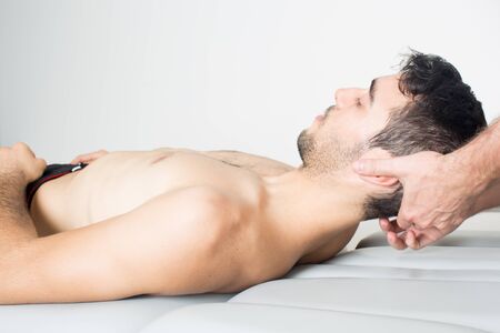 Doctor adjusting the spinal columnの写真素材