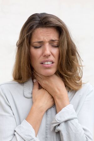 woman suffering from sore throat