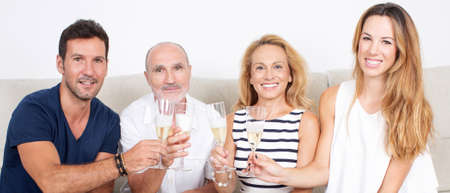 happy family celebrates with champagne