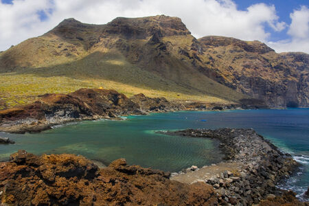 Mountains of Los Gigantes on the bay at Punta del Teno Tenerifeの写真素材