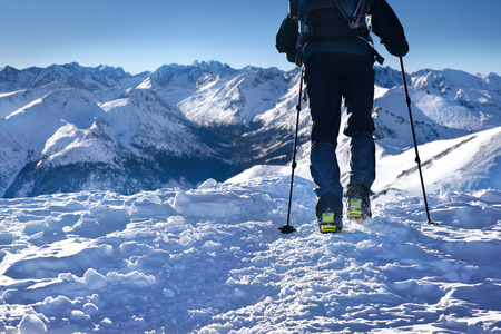 Man hiking in winter Tatra mountain peaks
