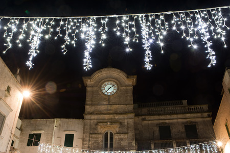 clock tower and illumination in Cisterninoの写真素材
