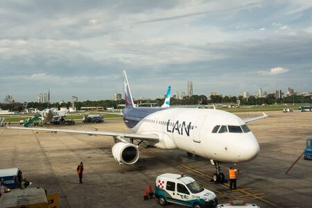 Buenos Aires, Argenitna - October 31, 2016: line airplane of LAN company parked for refueling and preparations before departureのeditorial素材