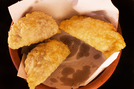 Argentinian empanadas on terracotta dish