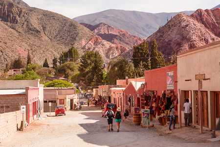 Purmamarca, Argentina - November 1, 2016: Street with souvenir shops and tourists in Purmamarca