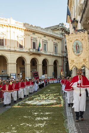 Chieti, Italy - 18 June 2017: Priests  in the religious procession of Corpus Domini with infiorata in Chietiのeditorial素材
