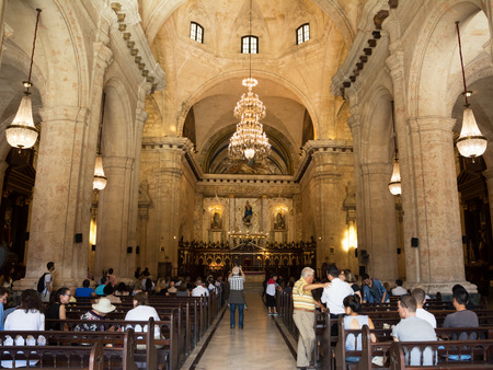 Havana, Cuba - December 3, 2017: Cathedral of Havana (Cuba) inside with faithful  and tourists in a December Sundayのeditorial素材