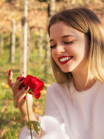 Girl Happy after having received a roseの写真素材