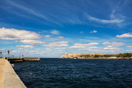 Havana, Cuba - December 11, 2017: Morro Castle and its lighthouse with clouds in blue skyのeditorial素材