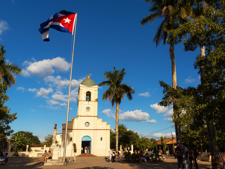 Vinales, Cuba - December 5, 2017: Main square with Church and cuban flag at  vinales with touristのeditorial素材