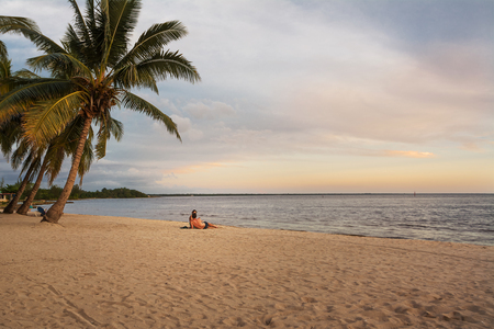 Couple at sunset on the Caribbean sea in Cubaの写真素材