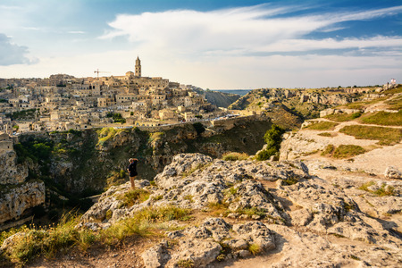 Matera, Italy - August 18, 2018: Tourists watching the Sassi di Matera from the opposite hillのeditorial素材