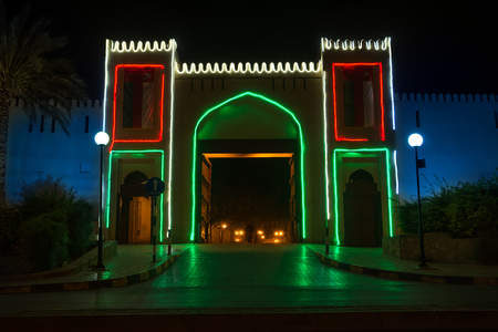Entrance door to Nizwa souk illuminated at night (Oman)のeditorial素材