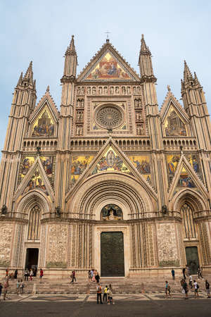 Orvieto, Italy - 20 september 2020: Facade of the Orvieto basilica decorated with mosaics and touristsのeditorial素材